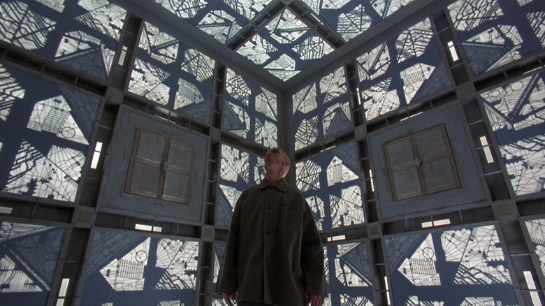 Julian Richings as Alderson in Cube, standing in one of the cube rooms.