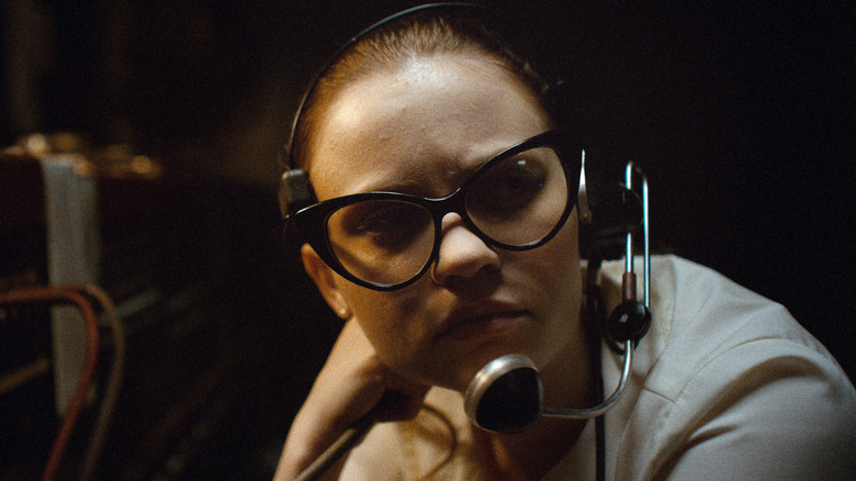 Sierra McCormick as Fay Crocker in The Vast of Night, wearing a radio headset.