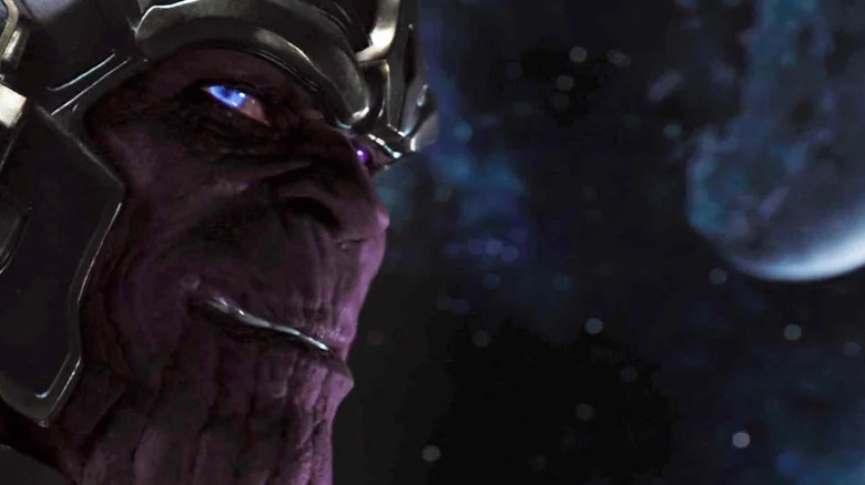 Thanos (Damon Poitier) glances back grinning in The Avengers