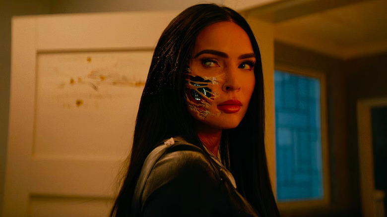 Megan Fox as android Alice with skin coming off to show the tech underneath in Subservience