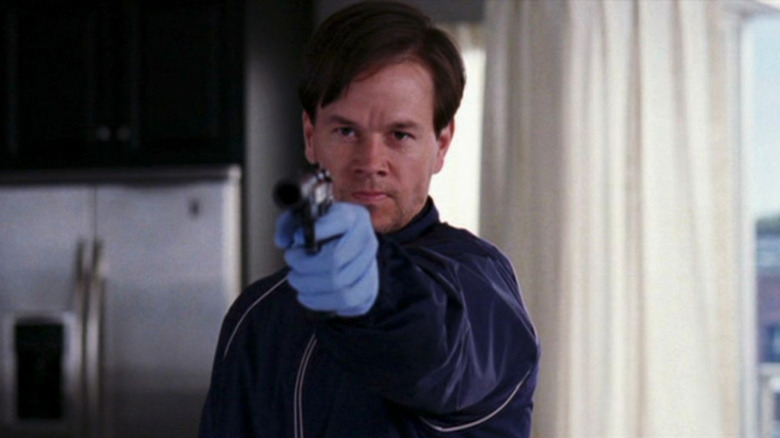 Mark Wahlberg as Sean Dignam, pointing a gun in The Departed.