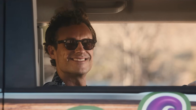 Nick Corirossi as Jack Jr. in The Napa Coys, smiling from inside a car with sunglasses on.