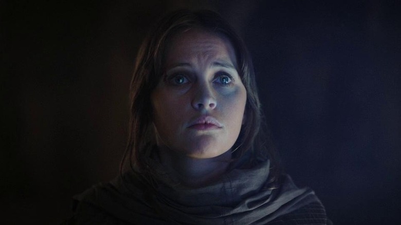 Jyn Erso (Felicity Jones) cloaked in shadows in Rogue One: A Star Wars Story