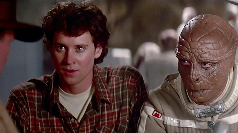 Lance Guest and Robert Preston as Alex and Centauri talking to someone in The Last Starfighter