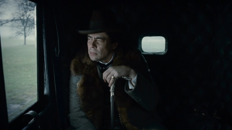 Benicio del Toro as Lawrence Talbot sitting in a carriage in The Wolf Man