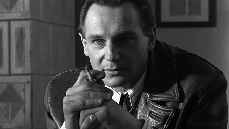 Liam Neeson as Oskar Schindler, holding a cigarette in Schindler's List.