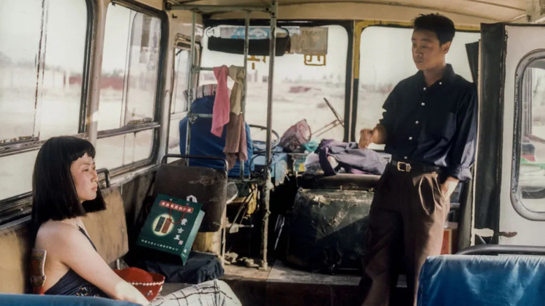Qiao and Bin in an abandoned motor home in Caught by the Tides