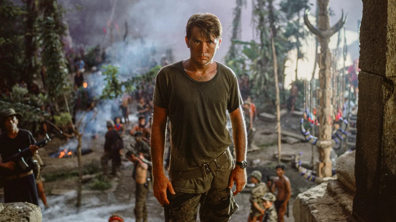 Martin Sheen as Benjamin Willard, walking through a village in Apocalypse Now.
