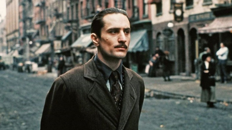 Robert De Niro as Vito Corleone, walking through the street in The Godfather Part II.
