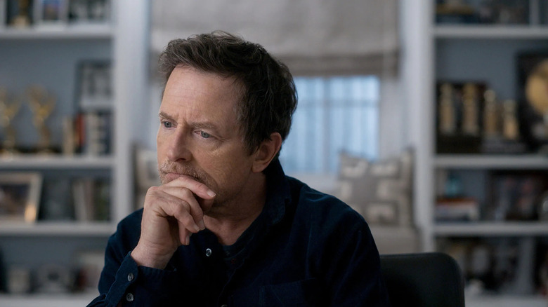 Michael J. Fox in Still: A Michael J. Fox movie, looking ponderous in front of the camera.
