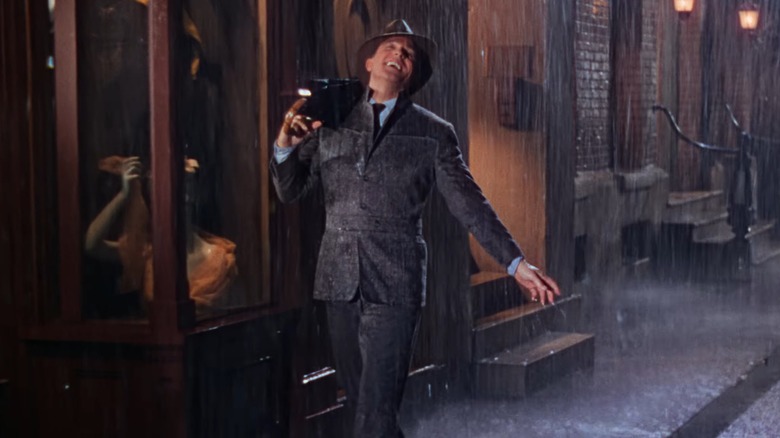 Gene Kelly as Don Lockwood, dancing and singing in the rain in Singin' in the Rain