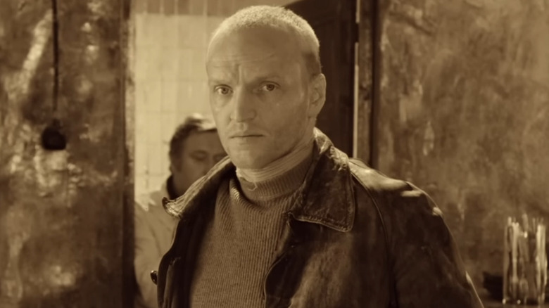 Alexander Kaidanovsky as the Stalker, staring into the camera in Stalker