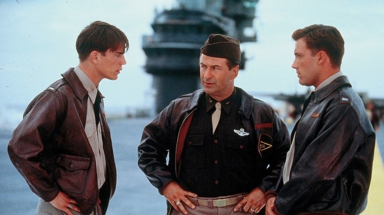 Alec Baldwin as Major Jimmy Doolittle standing in between Josh Hartnett as Danny Walker and Ben Affleck as Rafe McCawley staring intensely at one another in Pearl Harbor.