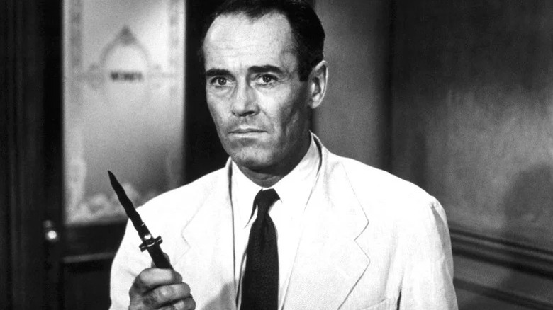 Juror 8 (Henry Fonda) holds up a switchblade in 12 Angry Men