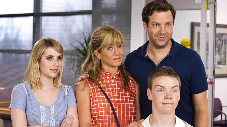 Emma Roberts, Jennifer Aniston, Jason Sudeikis, and WIll Poulter as Casey, Rose, David, and Kenny acting like a happy family in We're The Millers