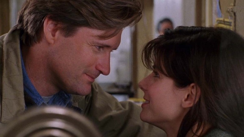 Bill Pullman and Sandra Bullock as Jack Callaghan and Lucy Eleanor Moderatz locking eyes in While You Were Sleeping