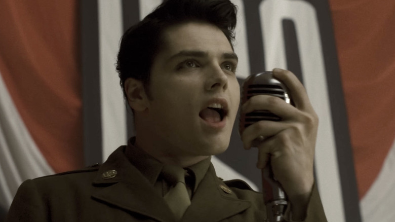 Gerard Way in a military uniform singing into a vintage mic in The Ghost of You music video