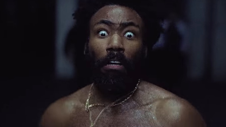 Donald Glover running shirtless in the This Is America video