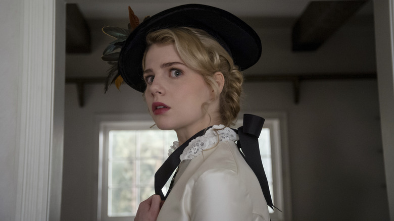 Polly Parsons (Lucy Boynton) looking behind herself in I Am the Pretty Thing That Lives in the House