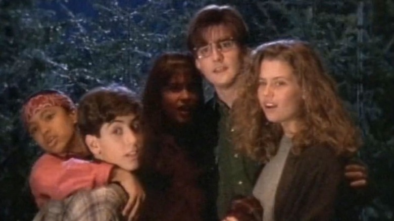 Raine Pare-Coull as Betty Ann, Jodie Resther as Kiki, Jason Alisharan as Frank Moore, Ross Hull as Gary, Rachel Blanchard as Kristen in Are You Afraid of the Dark, standing together as a group.