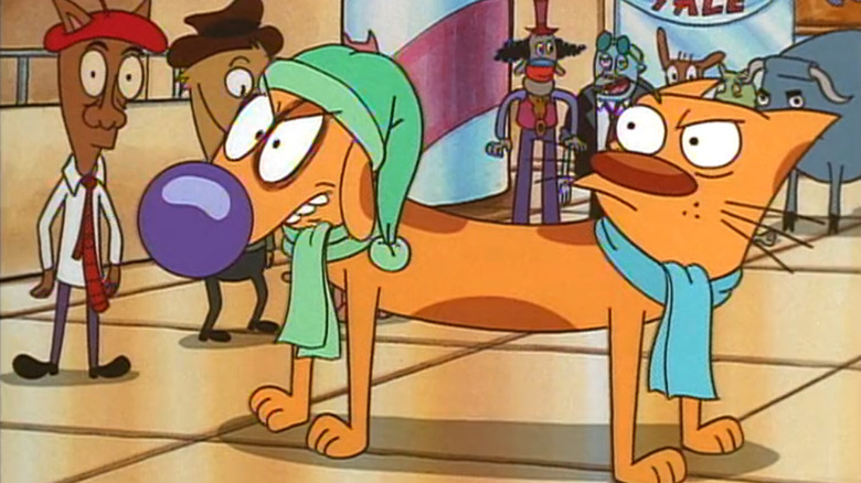 Jim Cummings as Cat and Tom Kenny as Dog in CatDog, each looking frustrated as they stand in a mall with other characters in the background.