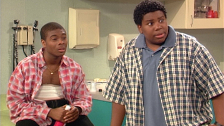 Kenan Thompson adn Kel Mitchell as themselves in Kenan & Kel, in a hospital room while Kel sits down with a bandage over his chest.