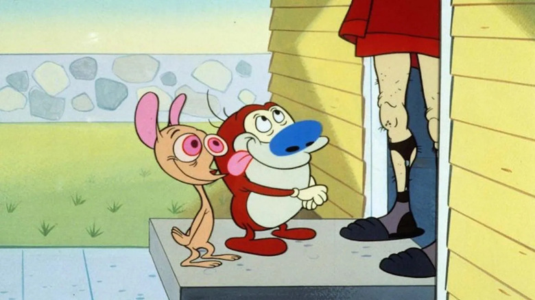 John Kfricfalusi as Ren and Billy West as Stimpy in The Ren & Stimpy Show, standing on the front doorstep of someone's house while standing in from of the human occupant's leg as they answer the door.
