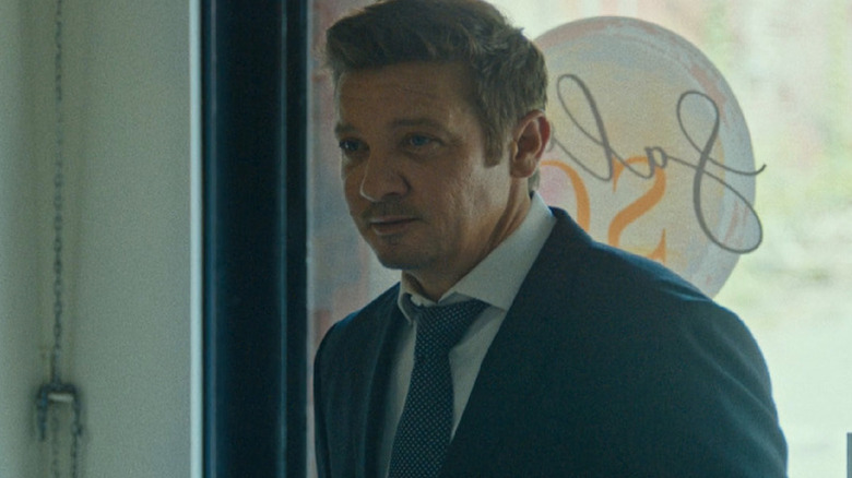 Mike McLusky (Jeremy Renner) stands inside of a restaurant in Mayor of Kingstown