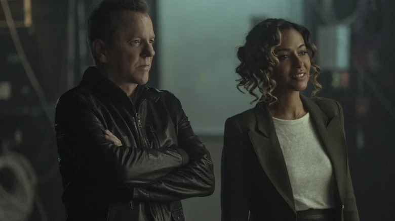 John Weir (Kiefer Sutherland) and Hailey Winton (Meta Golding) stand side-by-side in Rabbit Hole