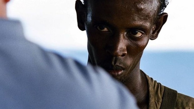 Abduwali Muse (Barkhad Abdi) glares at Captain Phillips (Tom Hanks) in Captain Phillips