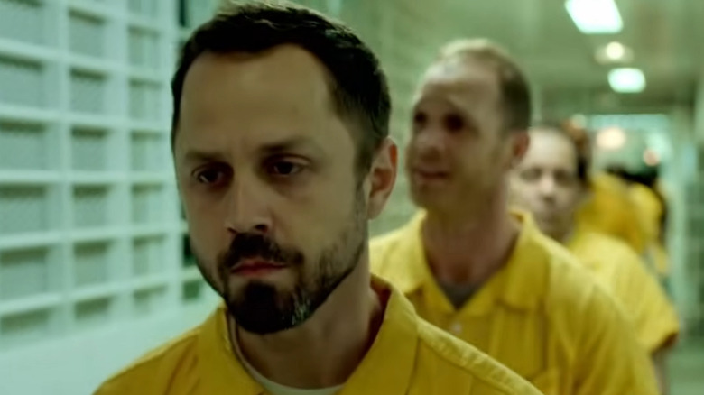 Pete Murphy (Giovanni Ribisi) walking in a prison on Sneaky Pete