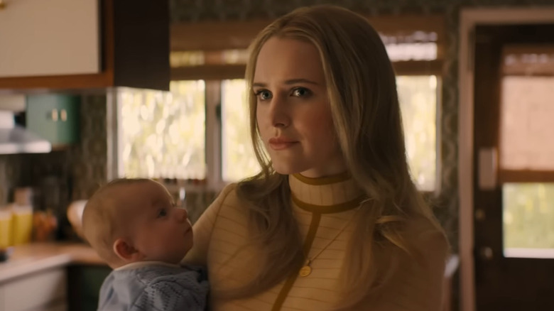 Jean (Rachel Brosnahan) holding her baby in I'm Your Woman