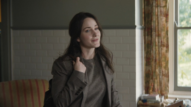 Sarah (Rachel Brosnahan) smiling in the kitchen in The Amateur