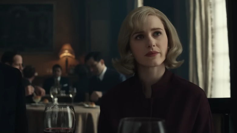 Emily (Rachel Brosnahan) sitting in a restaurant in The Courier
