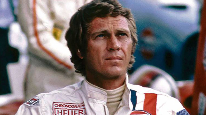 Michael Delaney (Steve McQueen) looks up on the side of the track in Le Mans