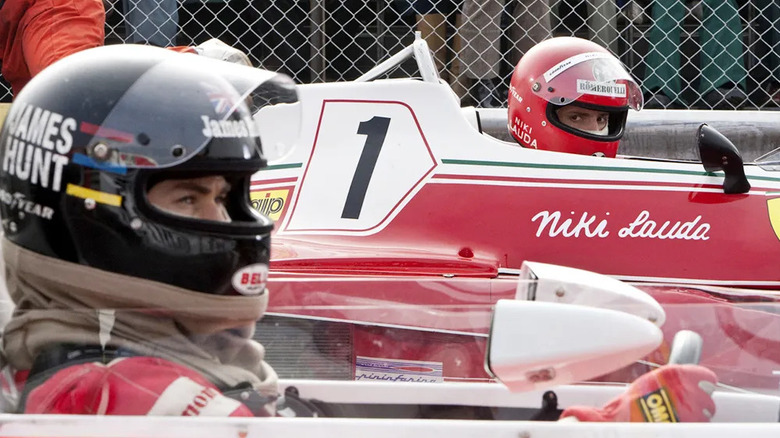 Niki Lauda (Daniel Brühl) stares at James Hunt (Chris Hemsworth) from his car in Rush (2013)