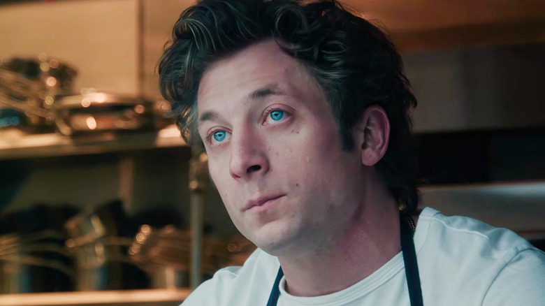 An emotional Carmy Berzatto (Jeremy Allen White) looks up in the kitchen in The Bear