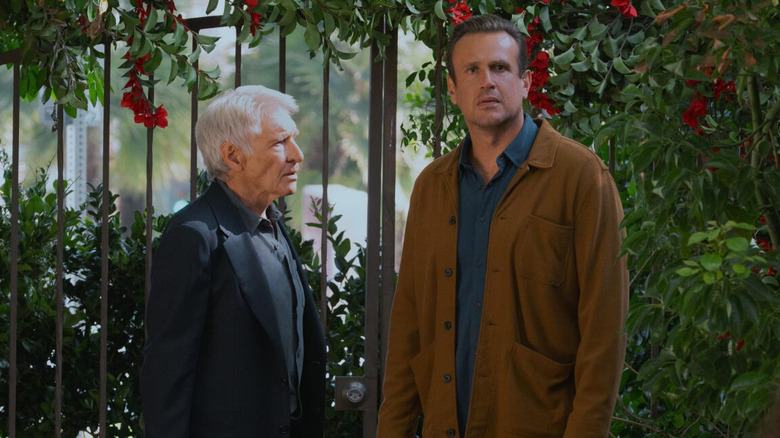 Jimmy Laird (Jason Segel) and Paul Rhoades (Harrison Ford) stand by a gate in Shrinking
