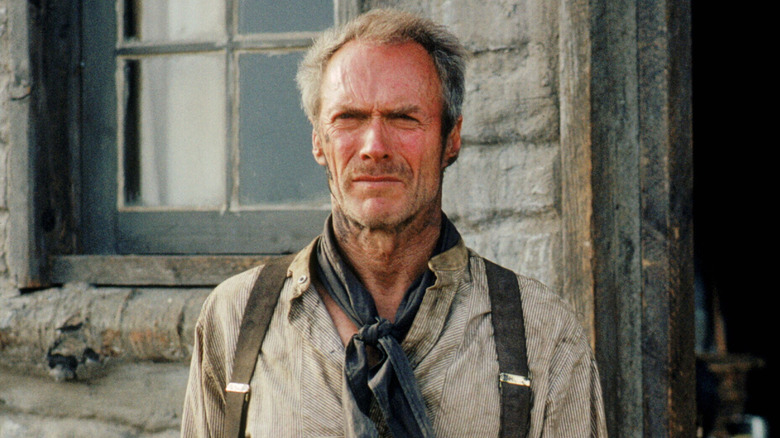 Clint Eastwood as William Munny in Unforgiven, standing on his porch