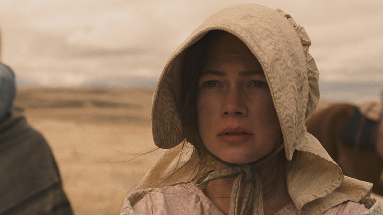 Michelle Williams as Emily Tetherow in Meek's Cutoff, looking ahead and wearing a bonnet.