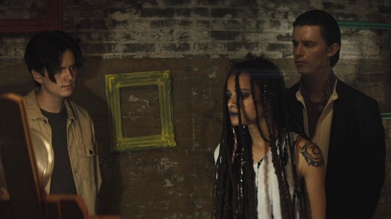 Sasha Lane as Cassie standing between Miles Robbins as Luke and Patrick Schwarzenegger as Daniel in Daniel Isn't Real