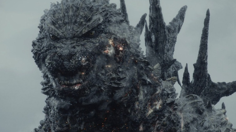 Godzilla looking mean and scary in a close-up in Godzilla: Minus One