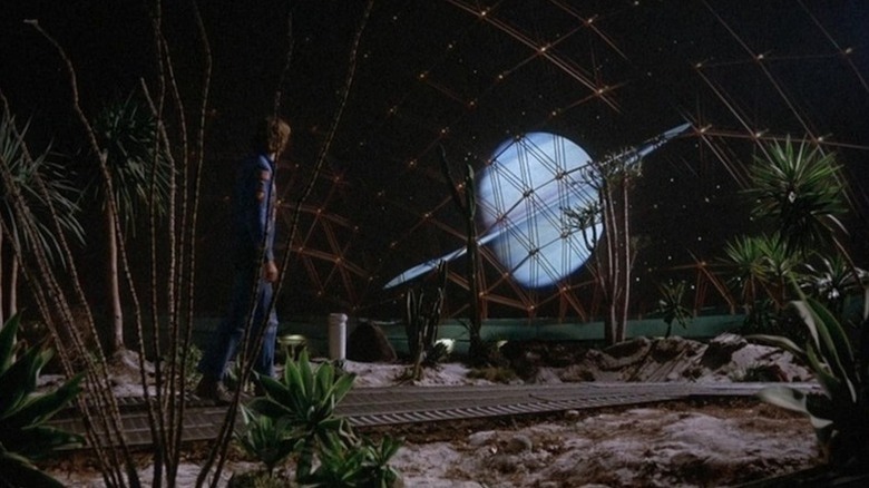 Freeman Lowell (Bruce Dern) surveys Saturn through a biodome in Silent Running