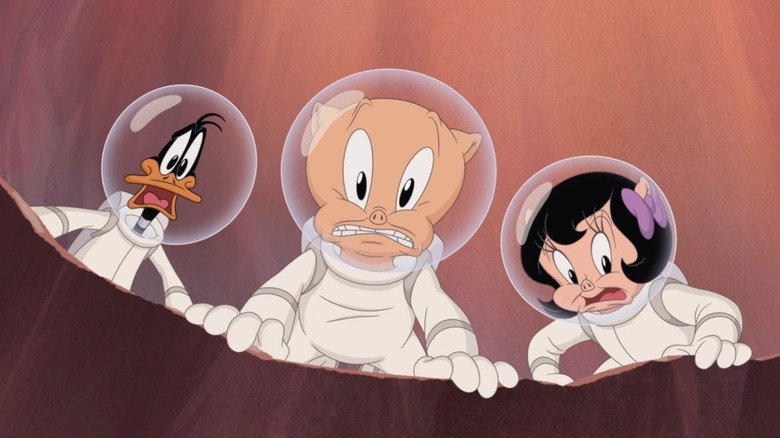 Daffy Duck, Porky Pig and Petunia Pig grimace in dismay while wearing spacesuits in The Day The Earth Blew Up