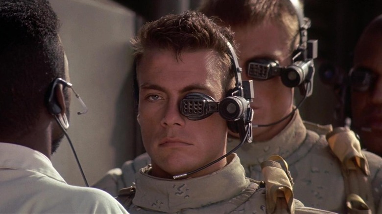 Jean-Claude Van Damme as GR44 and Dolph Lundgren as GR13, following orders in Universal Soldier