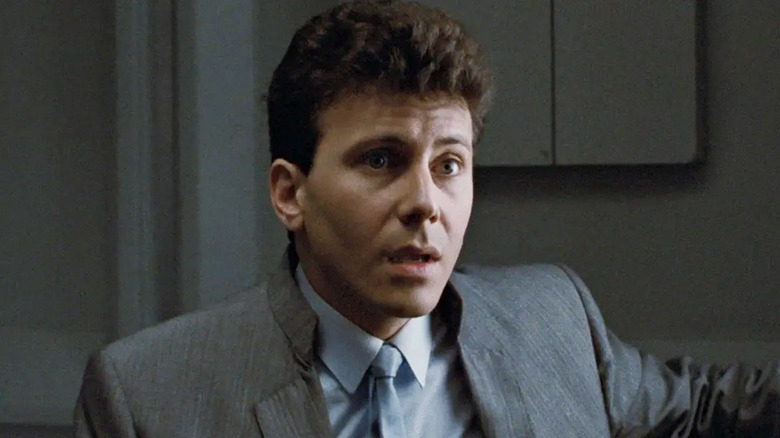 Carter Burke (Paul Reiser) stares at Ellen Ripley (Sigourney Weaver) in Aliens