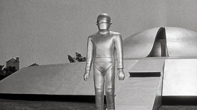Gort (Lock Martin) stands in front of a flying saucer in The Day the Earth Stood Still (1951)
