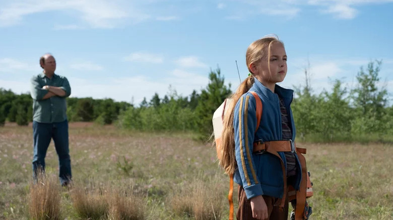 Ed (Dan Bakkedahl) in a field with Beth (Alessandra de Sa Pereira) on Tales From the Loop