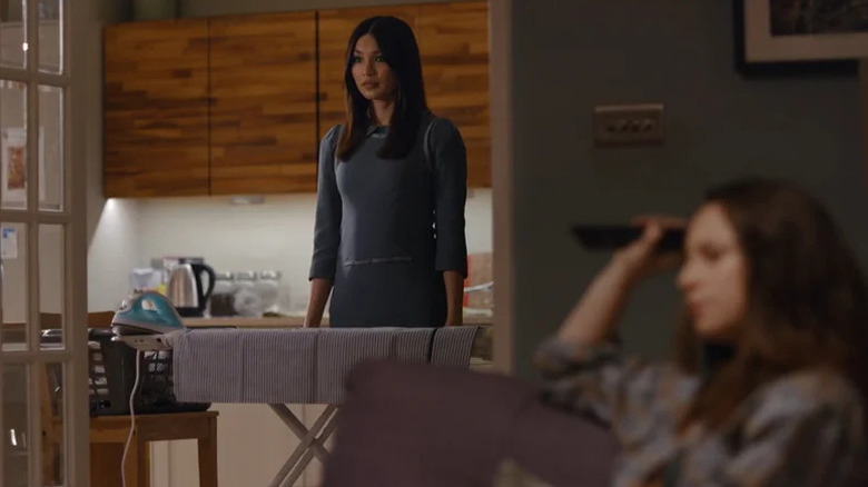 Anita (Gemma Chan) stands impassively over an ironing board in Humans