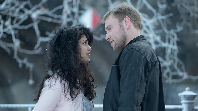 Kala Dandekar (Tina Desai) and Wolfgang Bogdanow (Max Riemelt) stare deeply at each other in the snow in Sense8